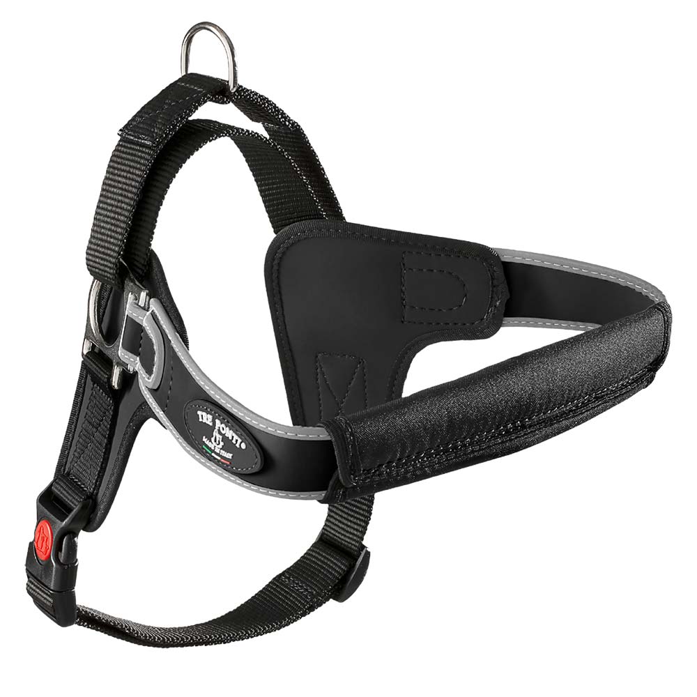 Black and gray dog harness with adjustable straps and metal ring.