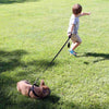 Boy running in grass holding Tre Ponti Mesh Leash in Black connected to French Bulldog wearing Tre Ponti Mesh Adjustable Harness in Black