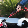 Person's hand holding second handle and showing shortened length of Tre Ponti Double Handle Short Leash in Red